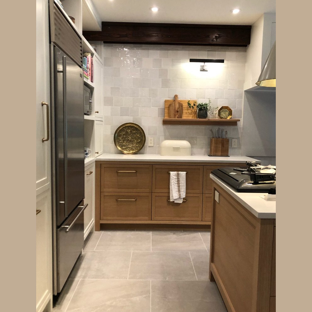 Contemporary kitchen with warm wood cabinetry, open shelving, and modern appliances, exemplifying elegant and functional interior design by Campo Design in Victoria, BC.