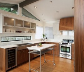 A kitchen with wood floors and white appliances.